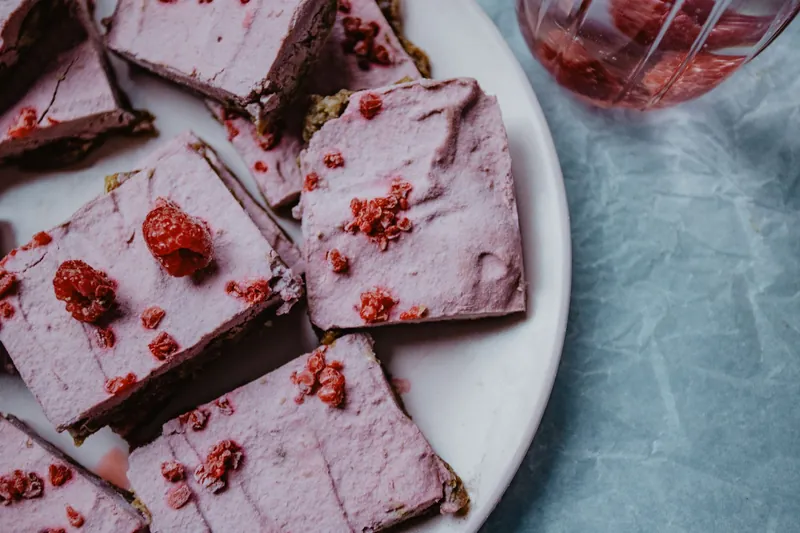 Raspberry cream bars on a plate
